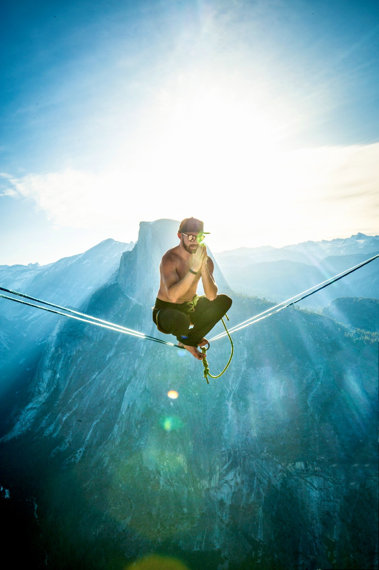 Ryan Robinson meditating on a highline in Yosemite
